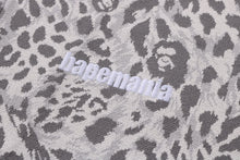 WILD LEOPARD PATTERN RELAXED FIT HALF ZIP SWEATSHIRT
