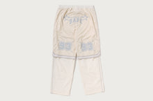 LAYERED TRACK PANTS