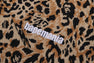 WILD LEOPARD PATTERN RELAXED FIT HALF ZIP SWEATSHIRT