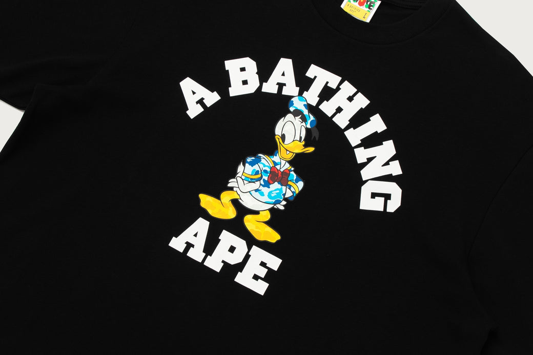 BAPE X DISNEY 】DONALD DUCK COLLEGE RELAXED FIT TEE | bape.com