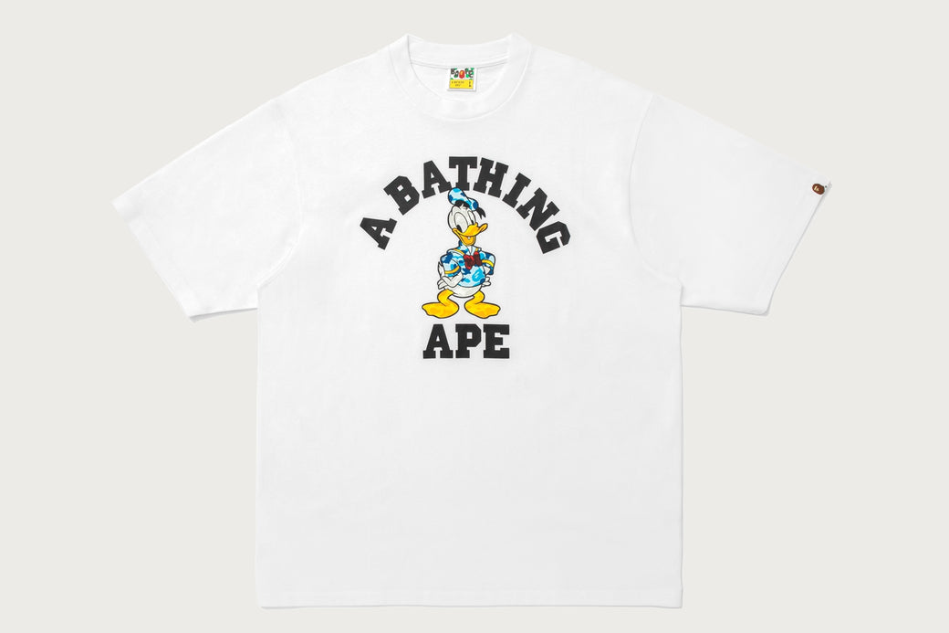 BAPE X DISNEY 】DONALD DUCK COLLEGE RELAXED FIT TEE | bape.com