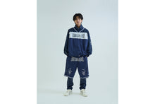 LAYERED TRACK PANTS
