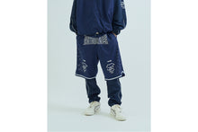 LAYERED TRACK PANTS